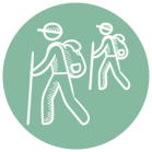 Two hikers with backpacks and walking sticks